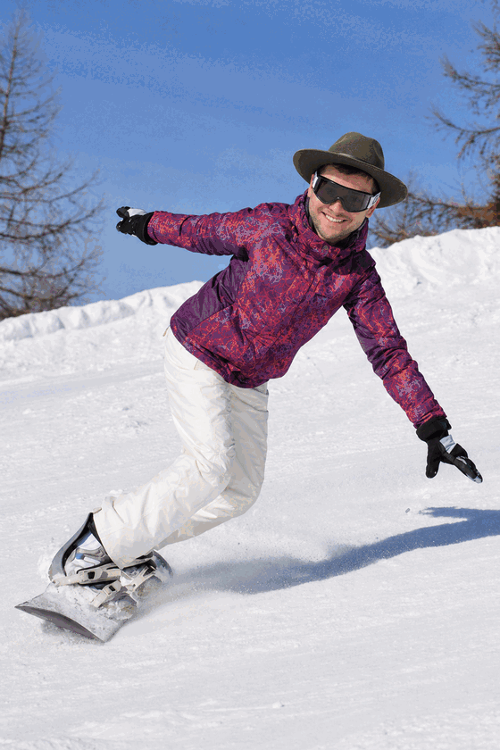 Snowboarder gearing up from light kit to full pillow armor